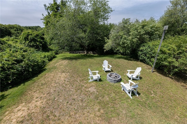 21 Overlook Ave, Charlestown, RI 02813 - view of grassy yard with a fire pit and a wooded view