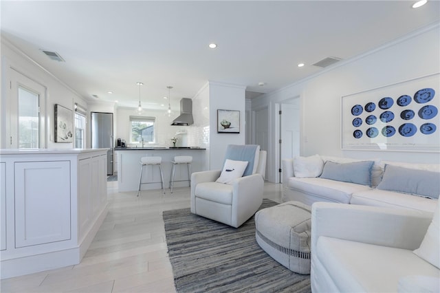 21 Overlook Ave, Charlestown, RI 02813 - living area with ornamental molding, recessed lighting, and light wood-type flooring