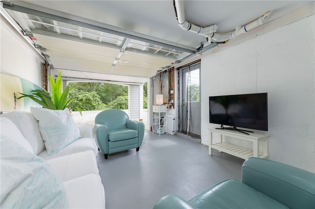 21 Overlook Ave, Charlestown, RI 02813 - living area featuring finished concrete flooring and a garage