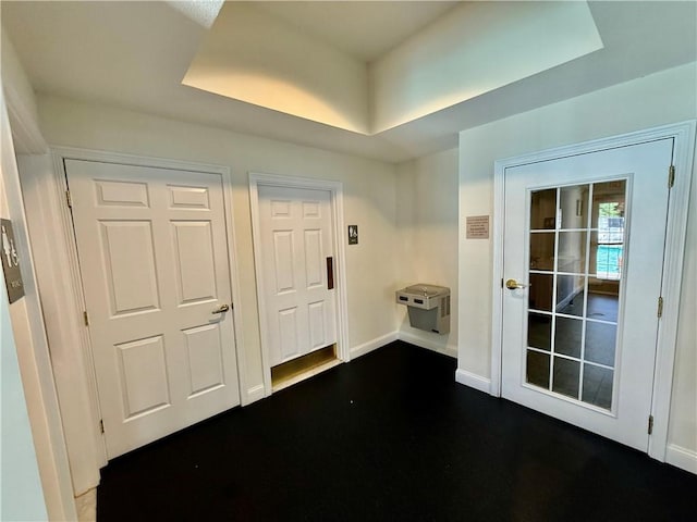 106 Mill St Unit 102, Woonsocket, RI 02895 - entrance foyer with a tray ceiling and baseboards