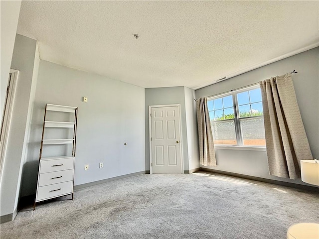 106 Mill St Unit 102, Woonsocket, RI 02895 - unfurnished bedroom with carpet flooring and a textured ceiling