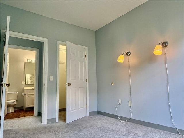 106 Mill St Unit 102, Woonsocket, RI 02895 - unfurnished bedroom featuring carpet and ensuite bathroom