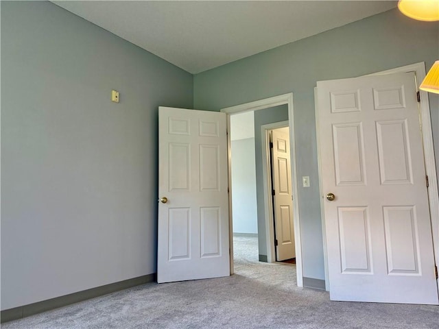106 Mill St Unit 102, Woonsocket, RI 02895 - unfurnished bedroom with carpet floors and baseboards