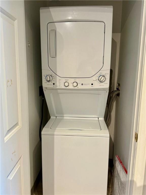 106 Mill St Unit 102, Woonsocket, RI 02895 - laundry room featuring stacked washer / drying machine