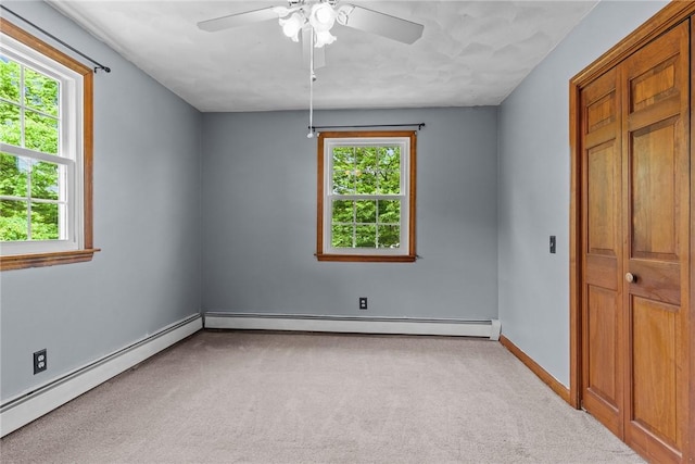 43 Peckham Pl, Bristol, RI 02809 - unfurnished bedroom featuring carpet flooring, a baseboard heating unit, and ceiling fan