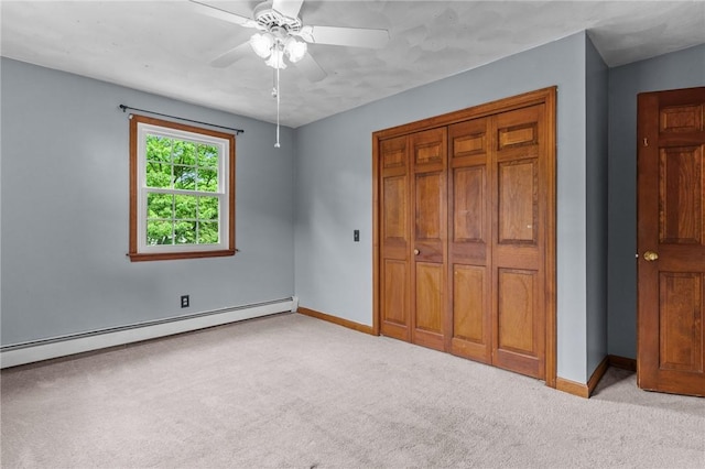 43 Peckham Pl, Bristol, RI 02809 - unfurnished bedroom featuring a baseboard radiator, light colored carpet, a closet, and a ceiling fan