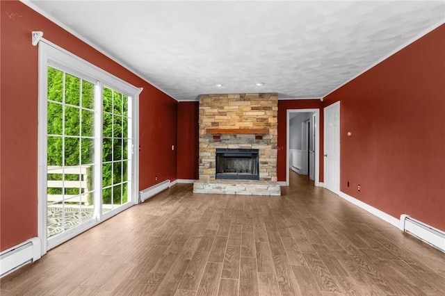 43 Peckham Pl, Bristol, RI 02809 - unfurnished living room featuring a baseboard radiator, wood finished floors, a stone fireplace, and baseboard heating