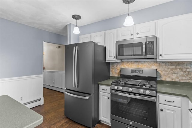 43 Peckham Pl, Bristol, RI 02809 - kitchen with stainless steel appliances, a baseboard heating unit, white cabinets, dark countertops, and wainscoting