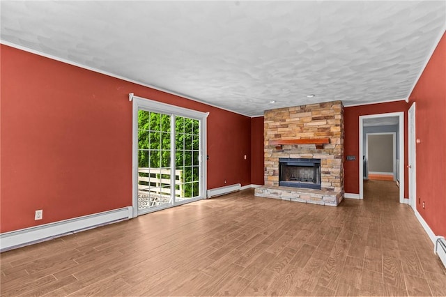 43 Peckham Pl, Bristol, RI 02809 - unfurnished living room with baseboard heating, wood finished floors, a fireplace, and a baseboard heating unit