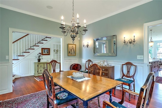25 Brayton Point Rd, Westport, MA 02790 - dining space featuring wood finished floors, a chandelier, stairway, a decorative wall, and ornamental molding