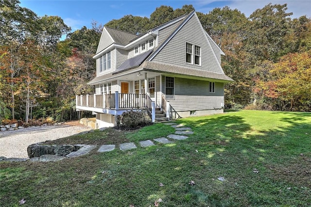 25 Brayton Point Rd, Westport, MA 02790 - view of front of home with a front lawn, a porch, and a garage