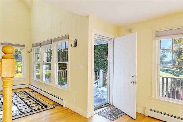 25 Brayton Point Rd, Westport, MA 02790 - entryway with a baseboard radiator, wood finished floors, and healthy amount of natural light