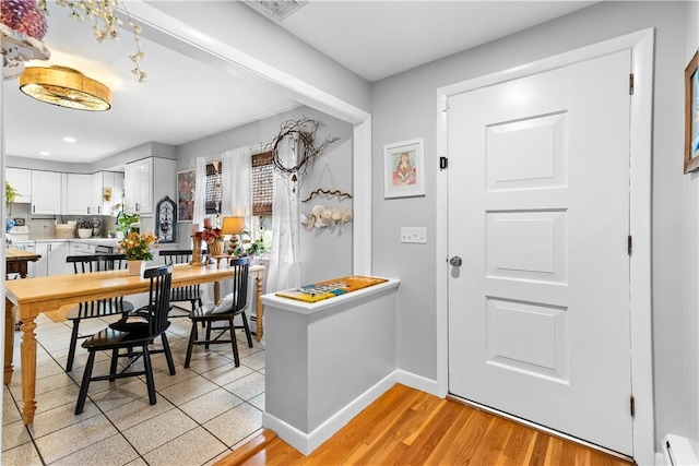 17 Golini Dr, Johnston, RI 02919 - kitchen with baseboard heating, healthy amount of natural light, recessed lighting, white cabinetry, and light wood-type flooring