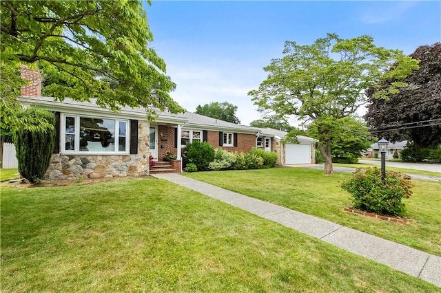 17 Golini Dr, Johnston, RI 02919 - ranch-style house featuring concrete driveway, a garage, stone siding, a front lawn, and a chimney