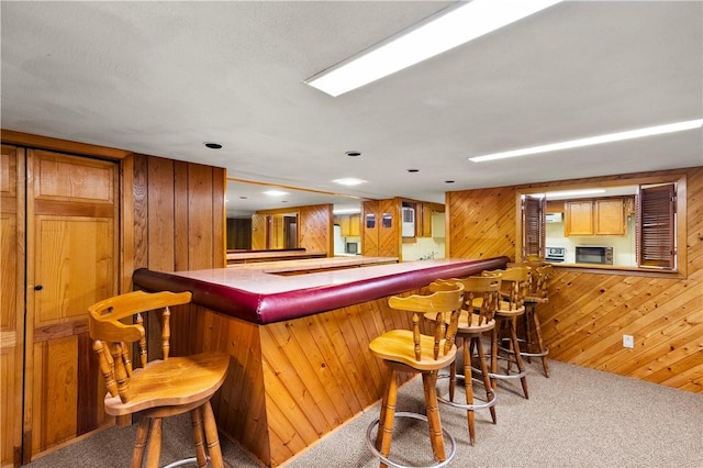 17 Golini Dr, Johnston, RI 02919 - indoor dry bar featuring carpet floors and wooden walls