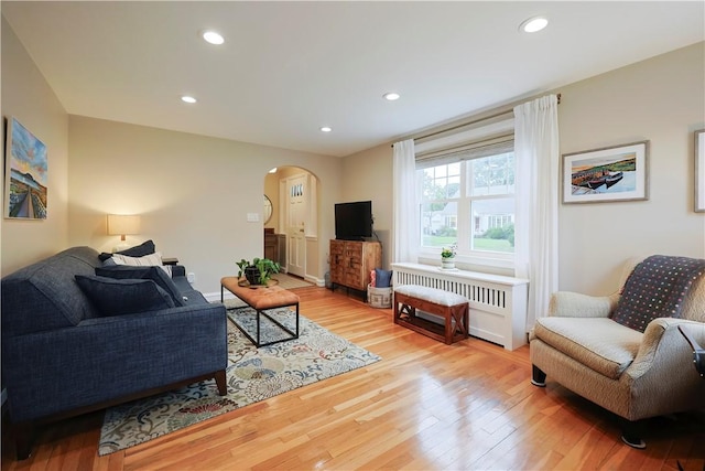 72 Audubon Rd, Warwick, RI 02888 - living area featuring arched walkways, wood finished floors, and recessed lighting
