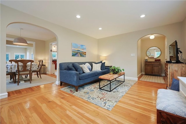 72 Audubon Rd, Warwick, RI 02888 - living room with arched walkways, wood finished floors, and recessed lighting
