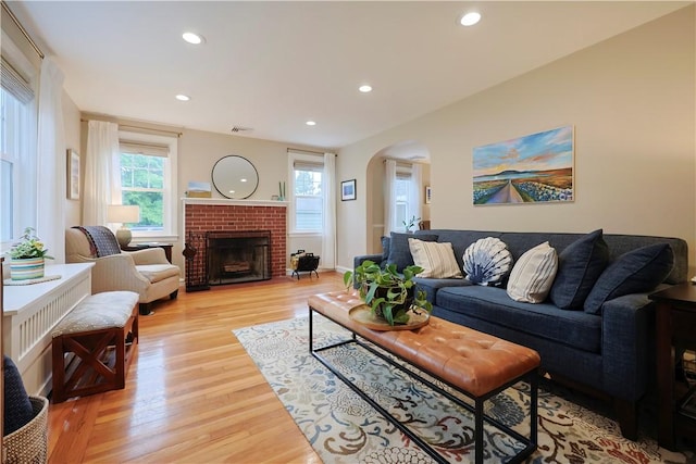 72 Audubon Rd, Warwick, RI 02888 - living area with arched walkways, plenty of natural light, light wood-type flooring, and recessed lighting