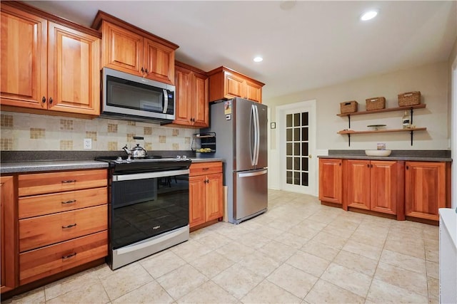 72 Audubon Rd, Warwick, RI 02888 - kitchen featuring appliances with stainless steel finishes, open shelves, dark countertops, decorative backsplash, and recessed lighting