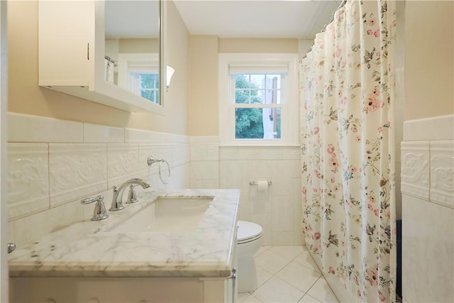 72 Audubon Rd, Warwick, RI 02888 - full bath with vanity, a wainscoted wall, tile patterned floors, tile walls, and a shower with curtain