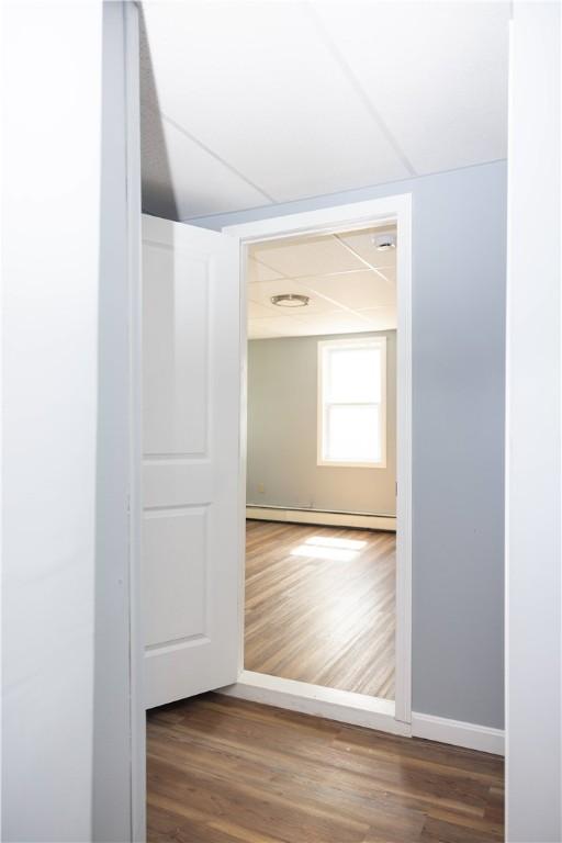 89 Warren Ave, East Providence, RI 02914 - hallway with a baseboard radiator and wood finished floors
