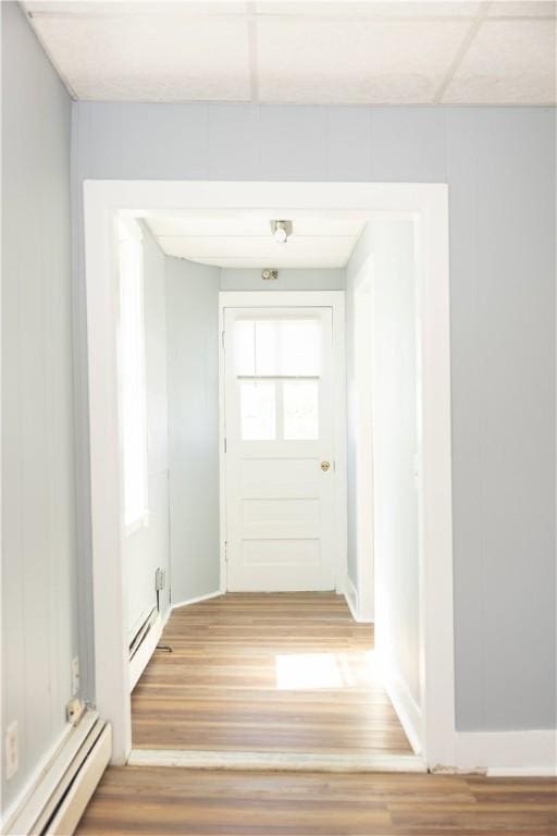 89 Warren Ave, East Providence, RI 02914 - hall with a baseboard heating unit and wood finished floors