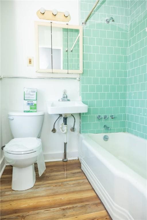 89 Warren Ave, East Providence, RI 02914 - bathroom with washtub / shower combination and wood finished floors