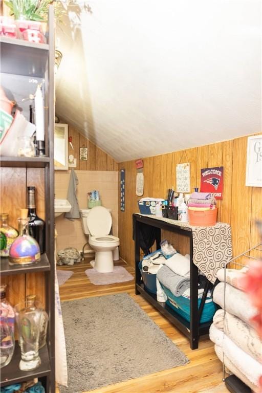 89 Warren Ave, East Providence, RI 02914 - bathroom with wood finished floors, wood walls, and vaulted ceiling