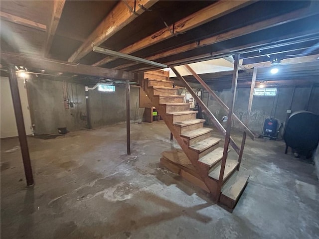 80 Silverwood Ln, West Warwick, RI 02893 - basement featuring stairway, heating fuel, and a water pressure tank