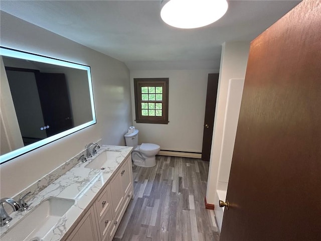 80 Silverwood Ln, West Warwick, RI 02893 - bathroom featuring a baseboard radiator, wood finished floors, and double vanity