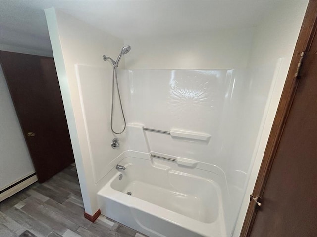 80 Silverwood Ln, West Warwick, RI 02893 - full bath featuring shower / bath combination, wood finished floors, and a baseboard heating unit