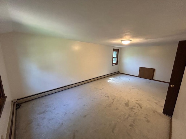 80 Silverwood Ln, West Warwick, RI 02893 - spare room with light colored carpet and a baseboard radiator
