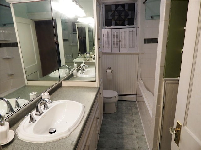 598 Admiral St, Providence, RI 02908 - bathroom with a baseboard radiator, vanity, tile patterned floors, and bathing tub / shower combination