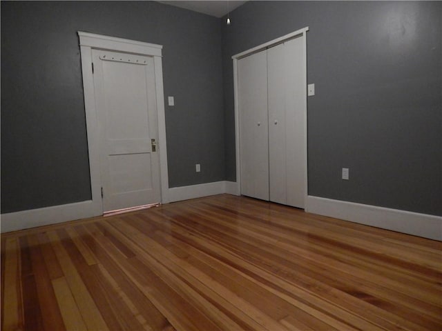 598 Admiral St, Providence, RI 02908 - unfurnished bedroom featuring wood finished floors and a closet