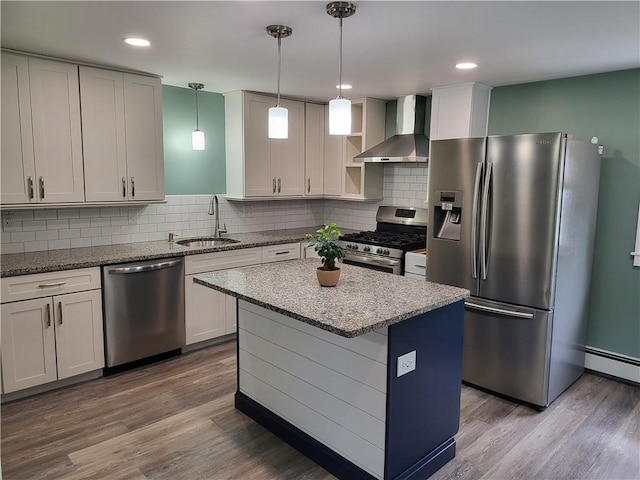 57 Merino St, Johnston, RI 02919 - kitchen featuring stainless steel appliances, wall chimney range hood, light stone countertops, tasteful backsplash, and dark wood finished floors