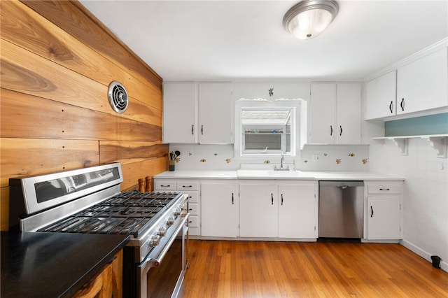 80 Highland Ave, South Kingstown, RI 02879 - kitchen with appliances with stainless steel finishes, open shelves, tasteful backsplash, and white cabinets