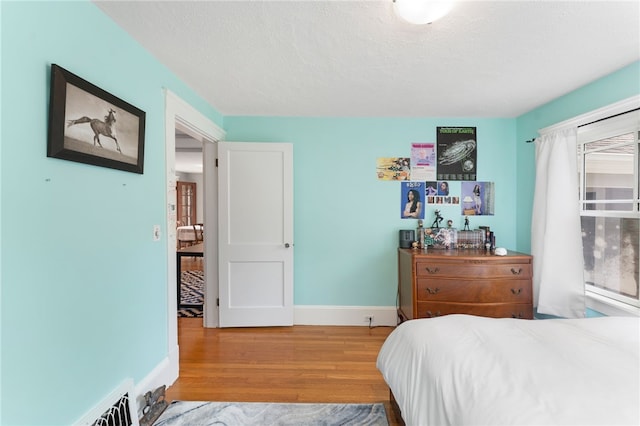 80 Highland Ave, South Kingstown, RI 02879 - bedroom featuring wood finished floors and a textured ceiling