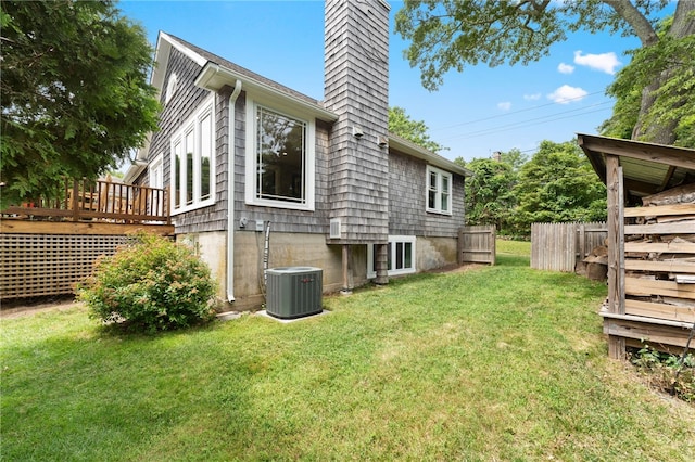 80 Highland Ave, South Kingstown, RI 02879 - back of property featuring a chimney and a wooden deck