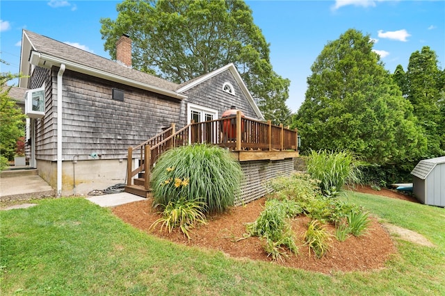 80 Highland Ave, South Kingstown, RI 02879 - back of house with a deck, a chimney, a yard, a storage shed, and stairs