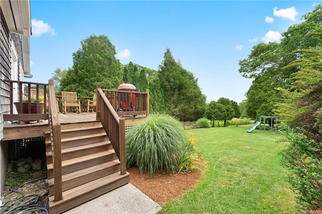 80 Highland Ave, South Kingstown, RI 02879 - view of green lawn with a playground, a deck, and stairway