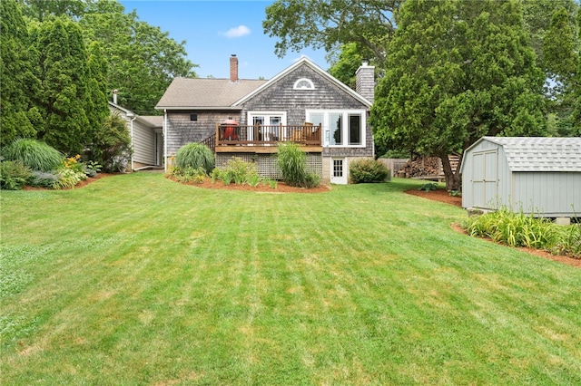 80 Highland Ave, South Kingstown, RI 02879 - rear view of house with a shed, a chimney, a wooden deck, and a yard