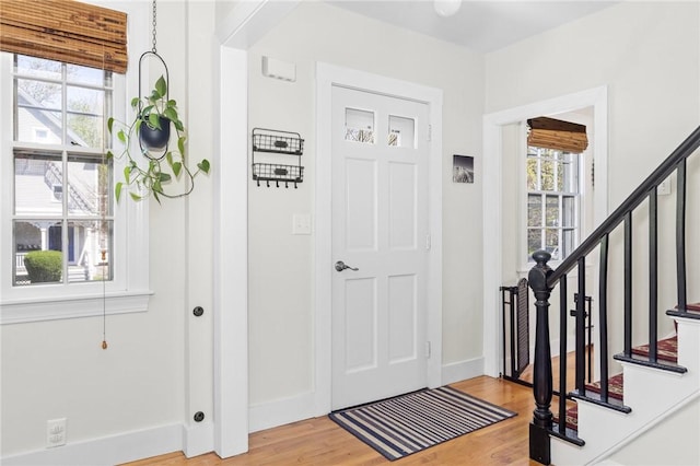 92 Franklin St, Bristol, RI 02809 - entrance foyer featuring plenty of natural light, light wood finished floors, and stairway