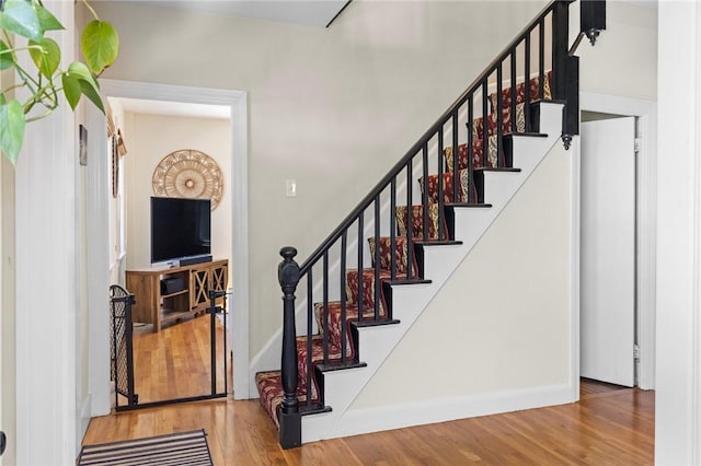 92 Franklin St, Bristol, RI 02809 - stairway featuring wood finished floors and baseboards