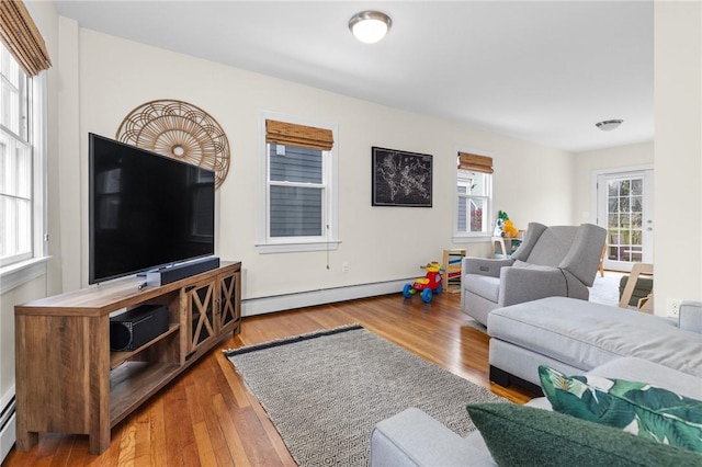 92 Franklin St, Bristol, RI 02809 - living room with a baseboard radiator, wood finished floors, and baseboard heating