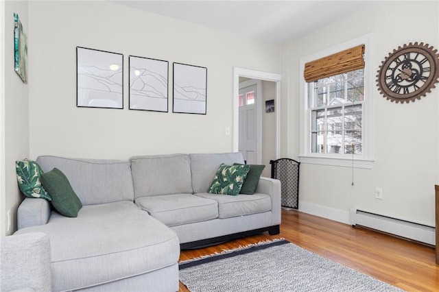 92 Franklin St, Bristol, RI 02809 - living room featuring baseboard heating and wood finished floors
