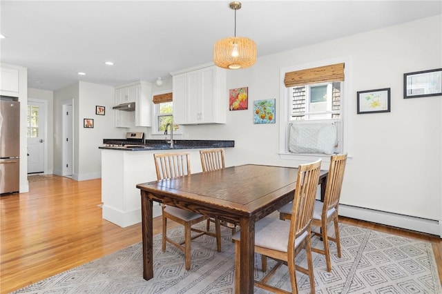 92 Franklin St, Bristol, RI 02809 - dining space with a baseboard radiator, recessed lighting, and light wood-style floors