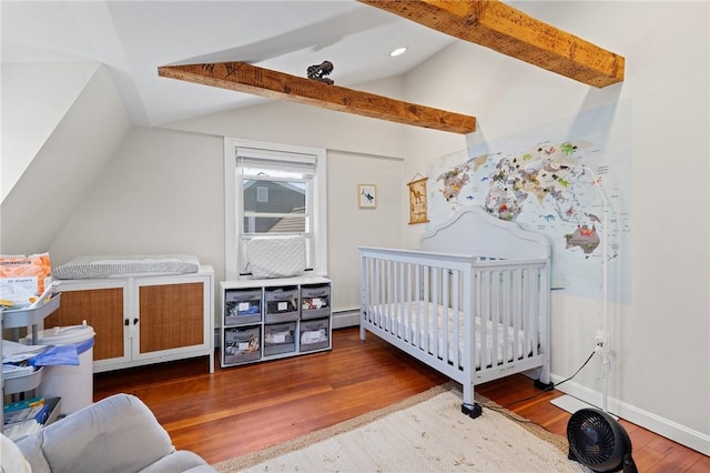 92 Franklin St, Bristol, RI 02809 - bedroom with wood finished floors, a baseboard heating unit, and a nursery area