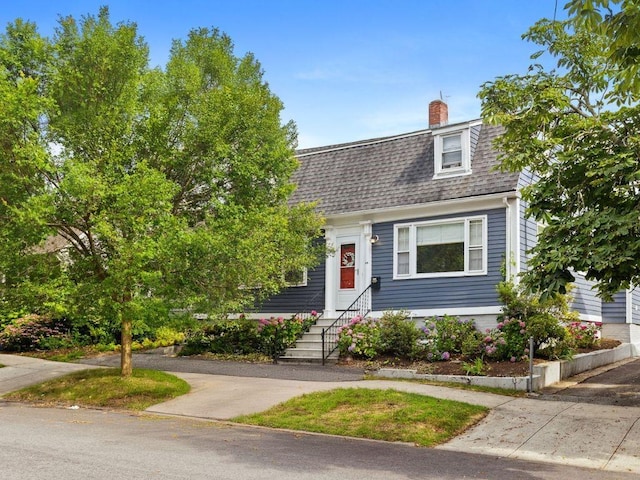 92 Franklin St, Bristol, RI 02809 - colonial inspired home featuring roof with shingles, entry steps, and a chimney