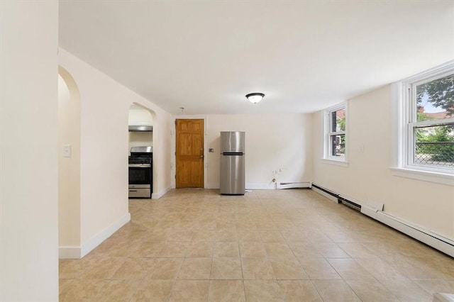 54 Harrison St, Pawtucket, RI 02860 - spare room featuring baseboard heating, arched walkways, and light tile patterned flooring