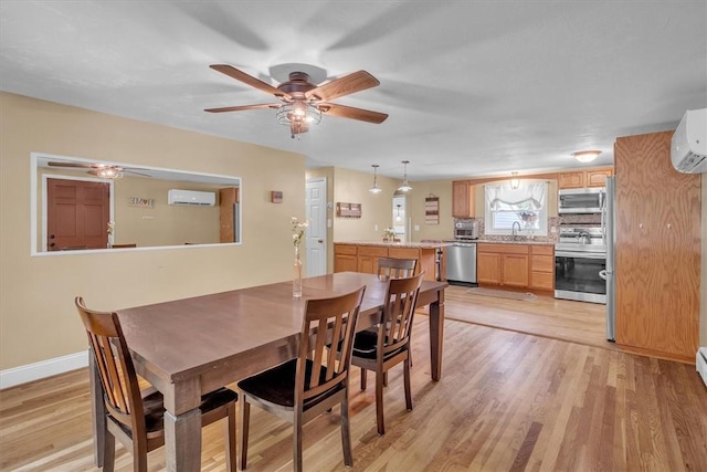 144 Hines Rd, Cumberland, RI 02864 - dining space featuring a wall unit AC, ceiling fan, and light wood finished floors